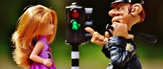 girl doll, policeman doll and traffic light